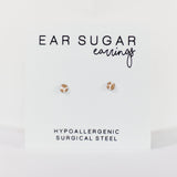 Ear sugar earrings on a white background with text indicating hypoallergenic and surgical steel material.