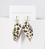 Leopard print earrings on a white card with 'Earsugarstuds.com' text.