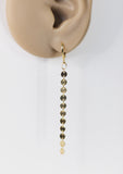 Long gold coin chain dangle earrings by Ear Sugar