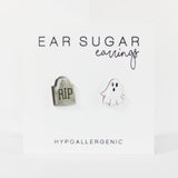 Two earrings shaped like a ghost and a tombstone on a white background with 'Ear Sugar' branding.
