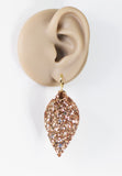 Rose gold glitter faux leather leaf dangle earrings by Ear Sugar