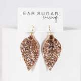 Rose gold glitter faux leather leaf dangle earrings by Ear Sugar