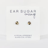 Pair of gold earrings on a white card with 'Ear Sugar' branding.