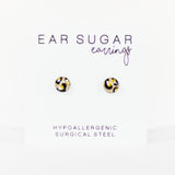 Pair of gold and black patterned earrings on a white card with 'Ear Sugar' branding.