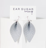 Teardrop-shaped earrings on a 'Ear Sugar' branded card against a white background