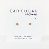 Pair of gold ear sugar earrings on a white background with text indicating hypoallergenic and surgical steel material.
