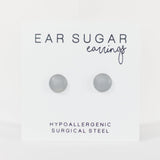 Pair of gray earrings on a white background with 'Ear Sugar' branding.