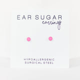 Pink ear sugar earrings on a white background with text indicating hypoallergenic and surgical steel material.