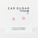 Advertisement for 'Ear Sugar' earrings with hypoallergenic surgical steel text on a white background.
