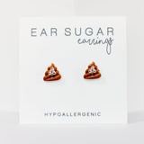 Ear sugar earrings shaped like poop emojis on a white background with text indicating hypoallergenic material.