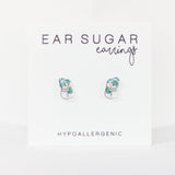 Snowman-shaped earrings on a white background with 'Ear Sugar' branding.