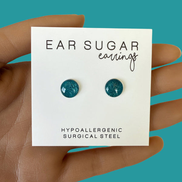 Snake eyes dark teal glitter stud earrings by Ear Sugar hypoallergenic made in the USA