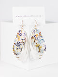White floral faux leather dangle earrings by Ear Sugar