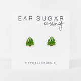 Green tree-shaped earrings on a white background with 'Ear Sugar' branding.