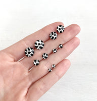 Cow print black and white studs hand painted earrings by Ear Sugar