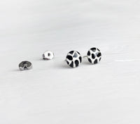 Cow print black and white studs hand painted earrings by Ear Sugar