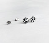 Cow print black and white studs hand painted earrings by Ear Sugar